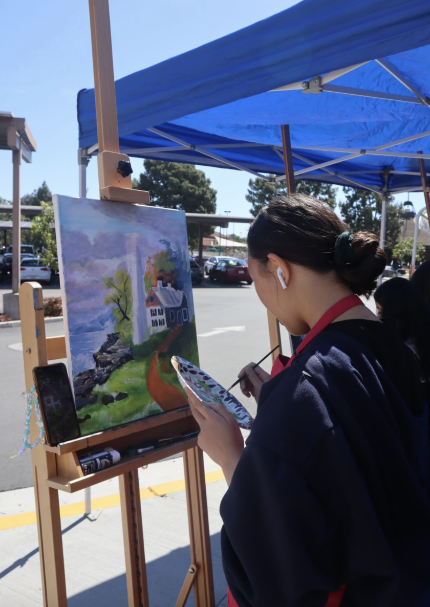 Junior Charli Chew participated in live painting for Fine Arts Day, creating artwork with beautiful scenery.